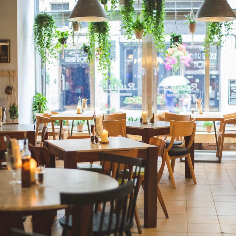 Interior seating and dining area at Rudy’s Pizza with casual tables and relaxed atmosphere