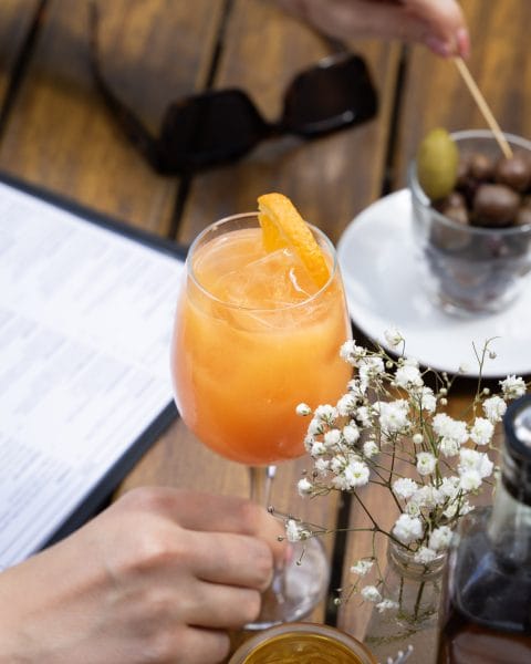 hand holding summer spritz