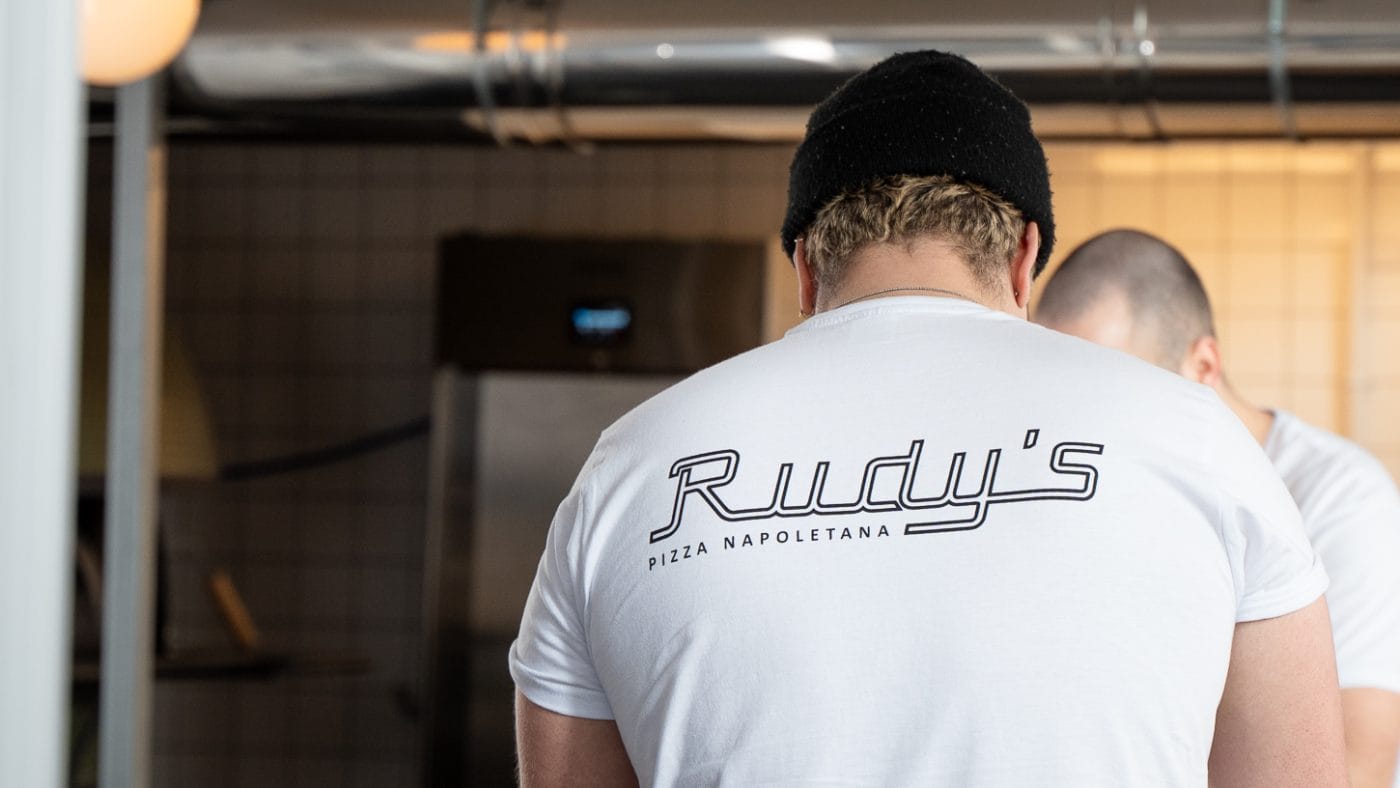 staff making pizza at rudy's