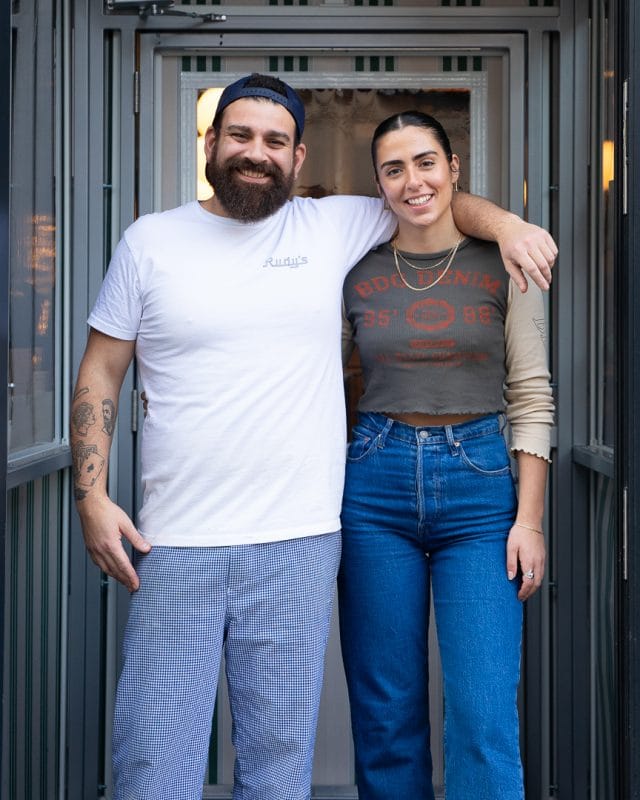 two rudy's pizza restaurant staff members