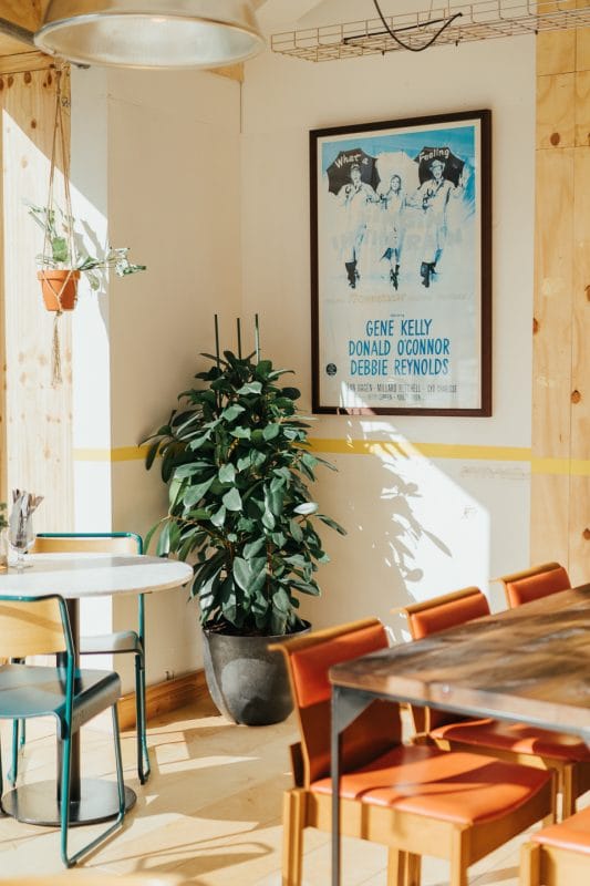 table and posters on the walls at italian restaurant