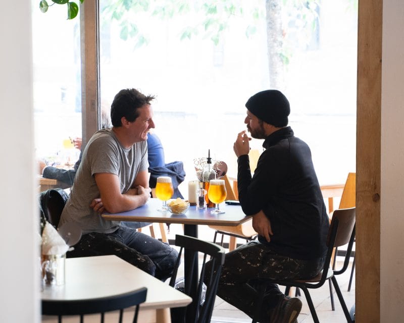 people enjoying drinks at pizza restaurant