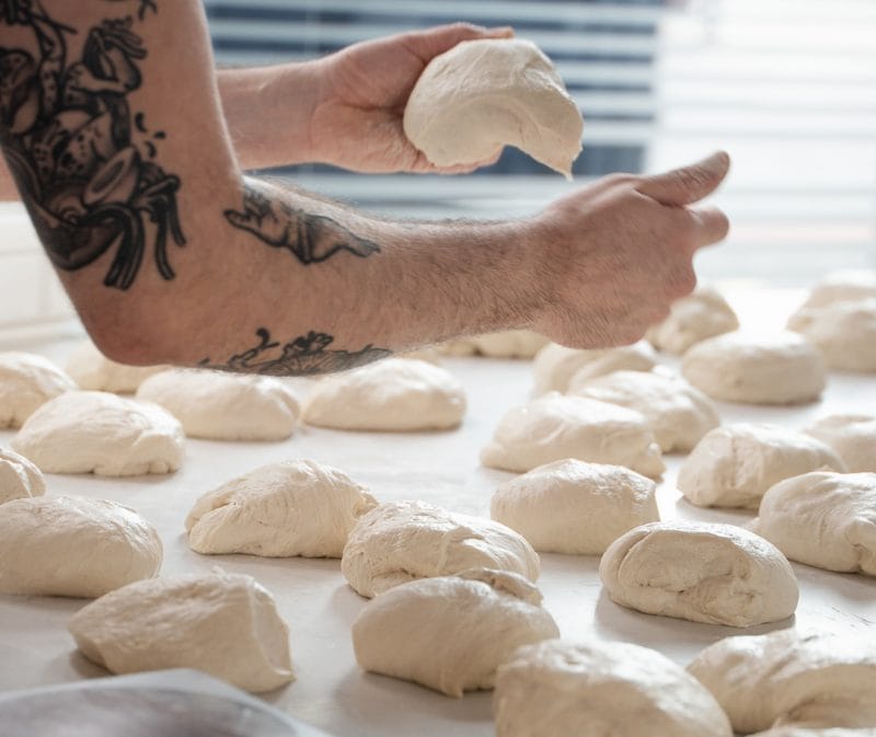 pizzaiolo making napoli pizza dough