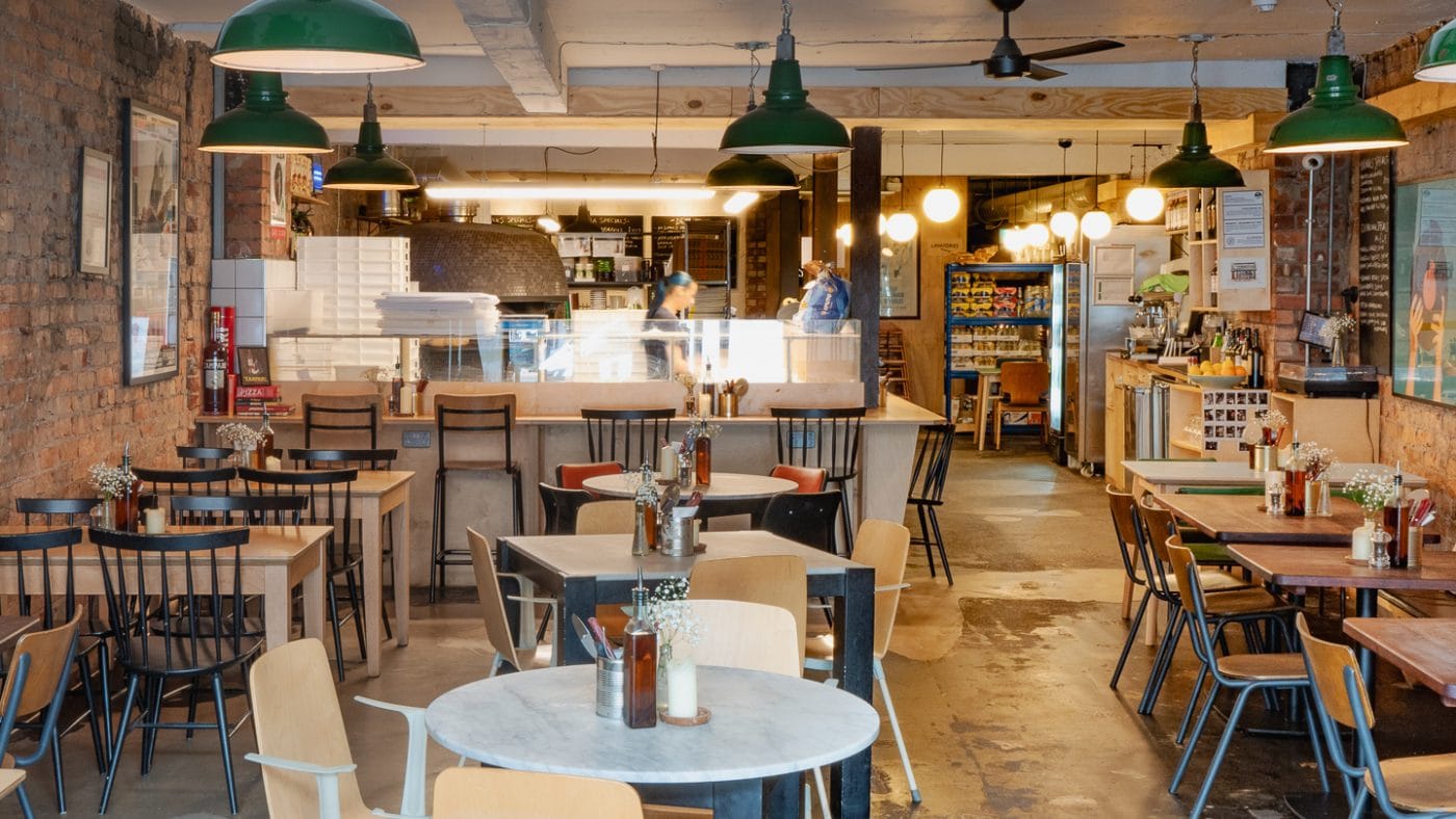 authentic neapolitan restaurant interior with tables for small and big groups