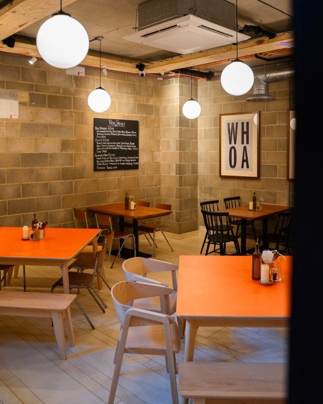 Interior of Rudy’s Pizza Napoletana Shoreditch set up for group dining