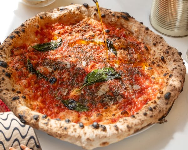 neapolitan style tomato base pizza with basil