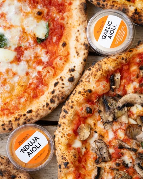 pizza crust and dipping sauce on the side