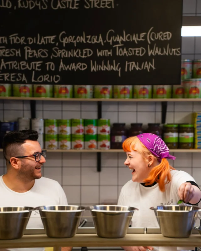 kitchen staff making neapolitan pizza
