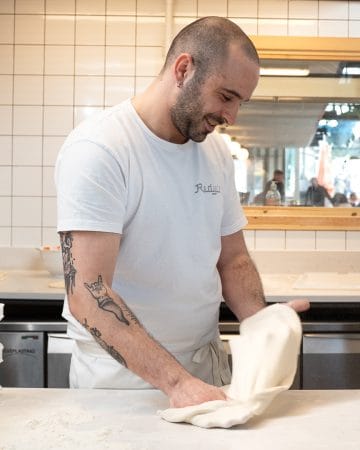 kitchen staff making napoli pizza dough