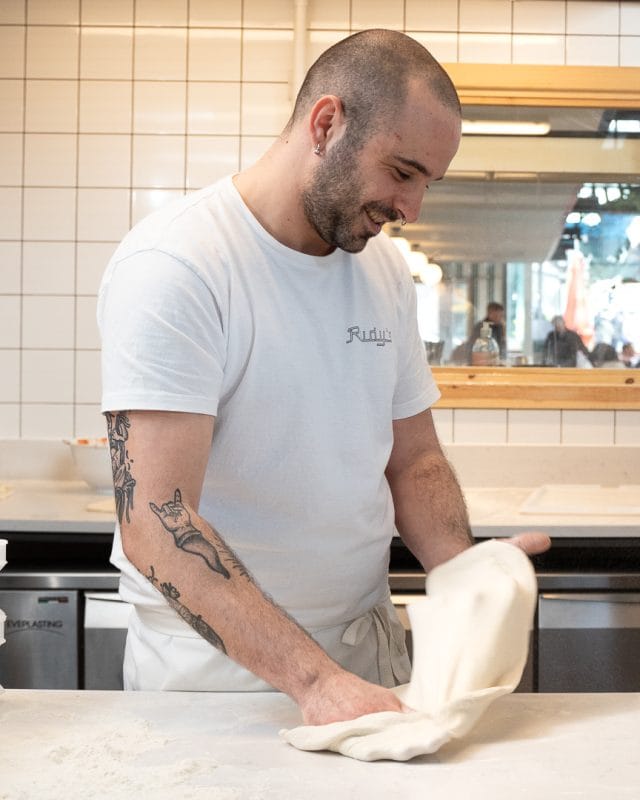 kitchen staff making napoli pizza dough