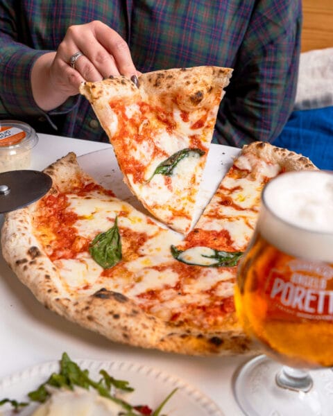 Margherita pizza with tomatoes, mozzarella, parmesan and basil