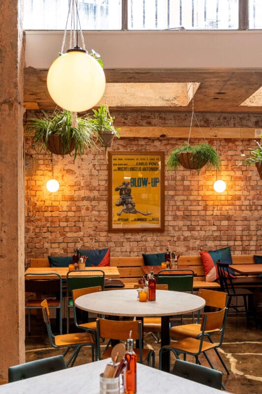 Interior of Rudy’s Pizza Bristol showing dining area, tables and seating