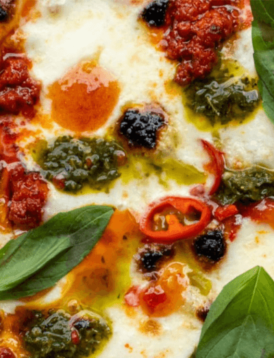 philomena pizza (mobile), topped with basil, pesto and chilli's