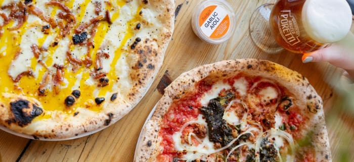 two pizzas with beer and garlic aioli